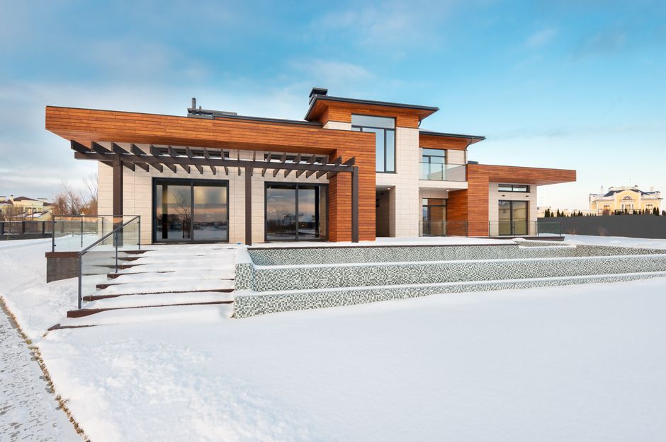 Exterior design of illuminated luxurious two storey villa with modern architecture