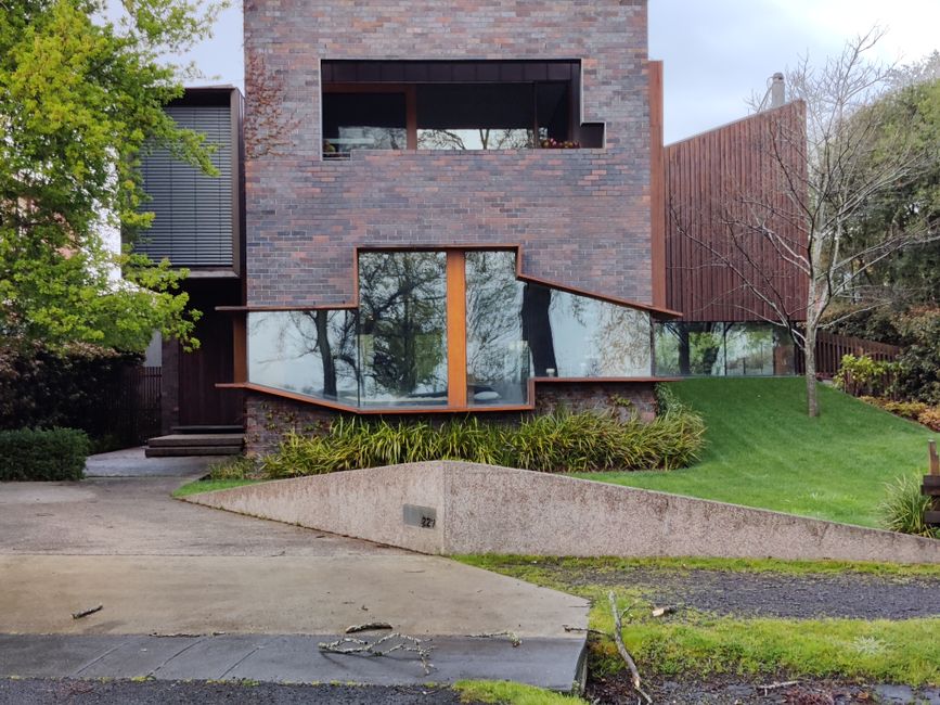 Stylish modern house with lush lawn and large windows